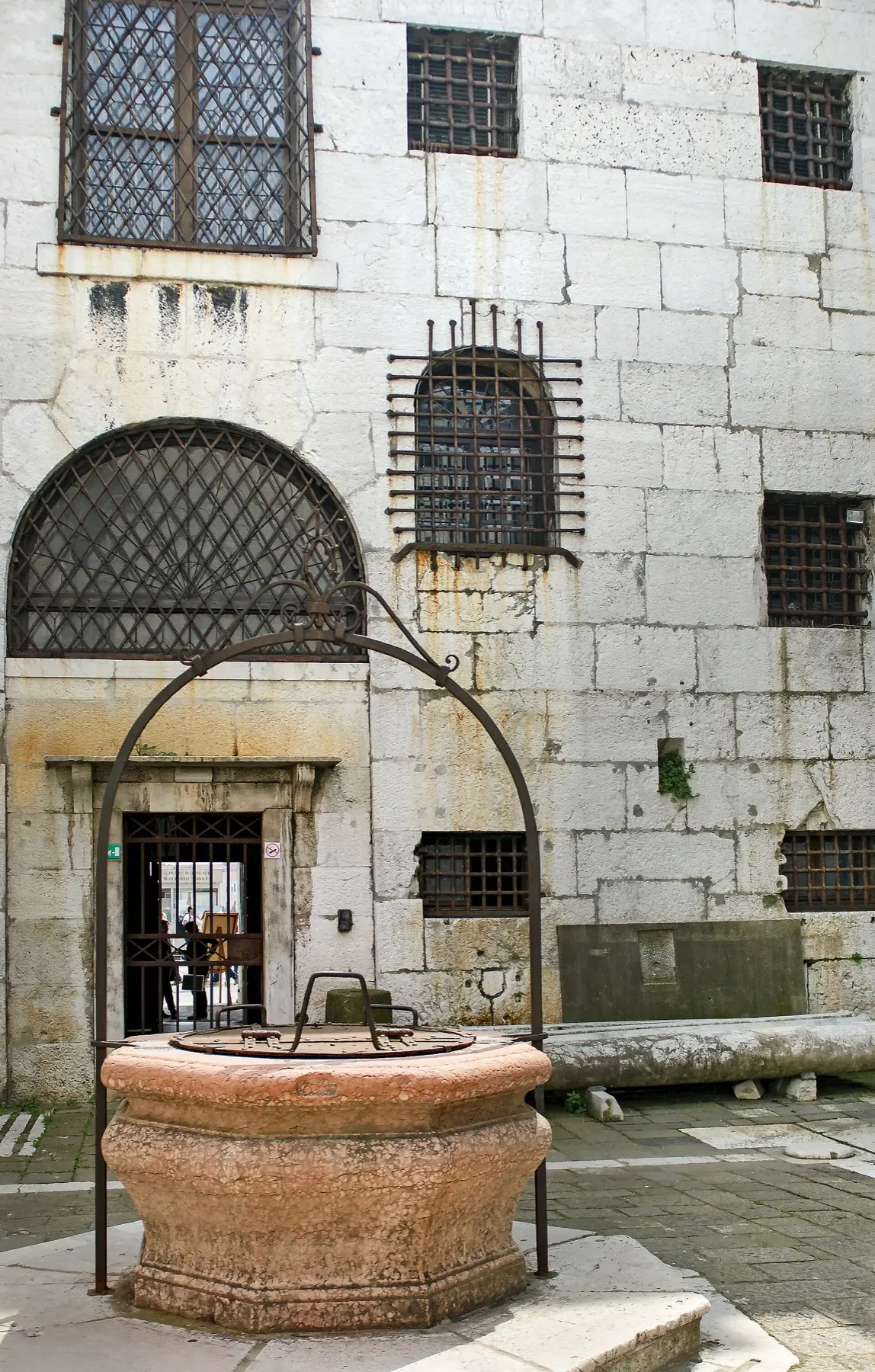 The inner courtyard of the New Prisons with its well